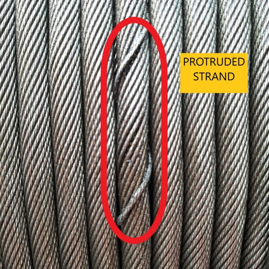 Raised strand visible on the surface of a steel wire rope