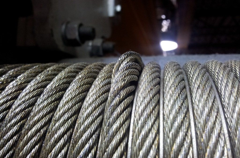 Steel wire rope winding onto a crane hoist drum
