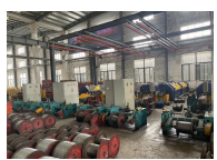 Wire rope sling production workshop with swaging presses and assemblies