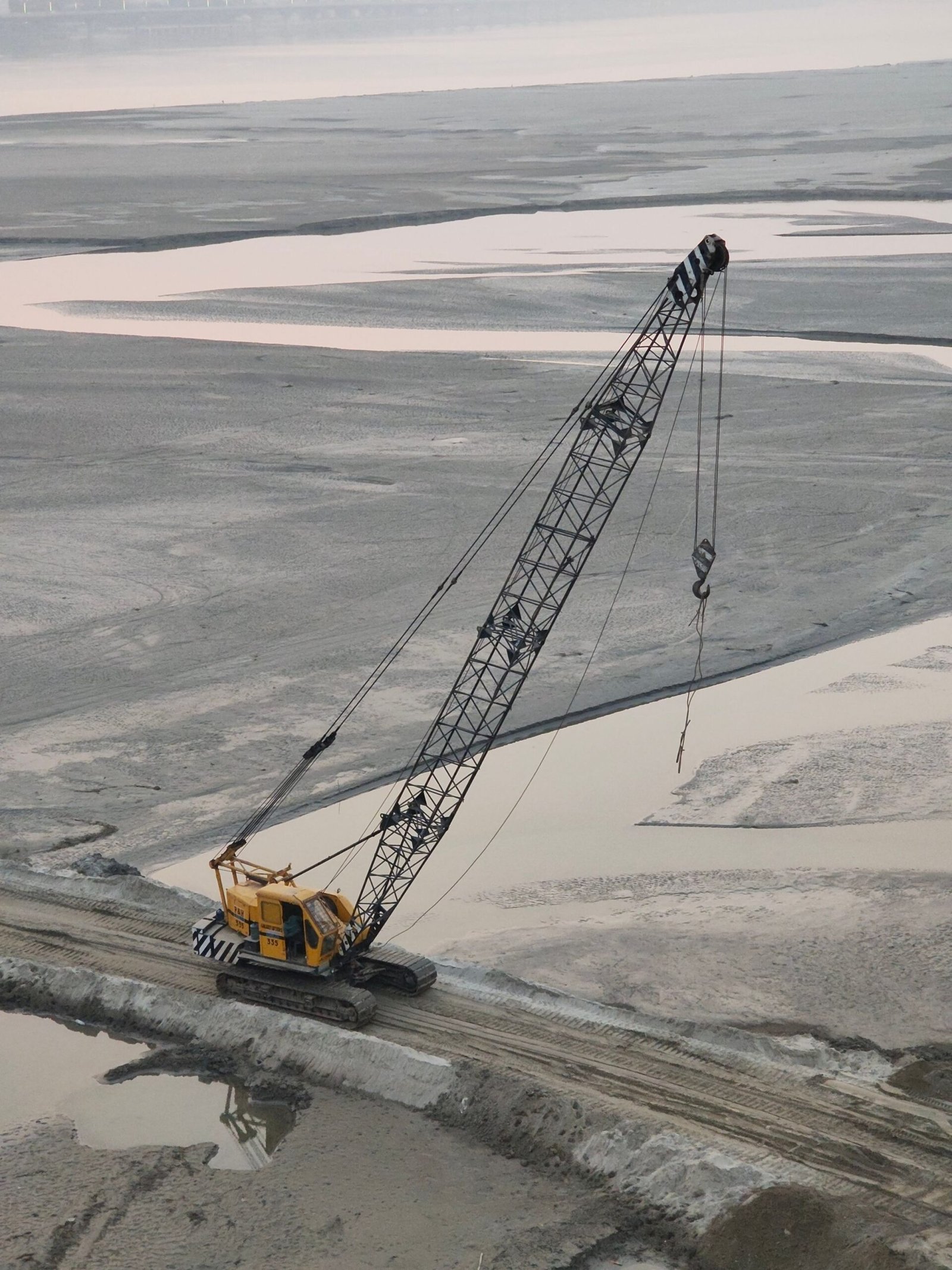 Large industrial crane at an active construction and excavation site