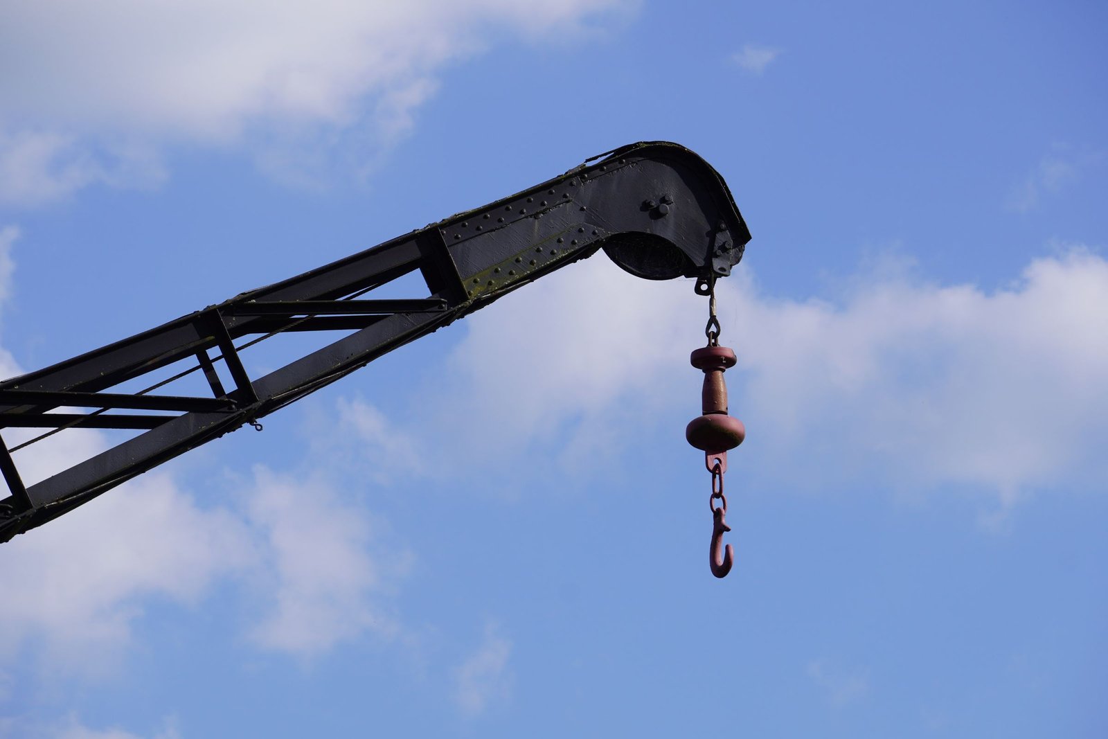 Crane lifting a large industrial load with wire-rope rigging